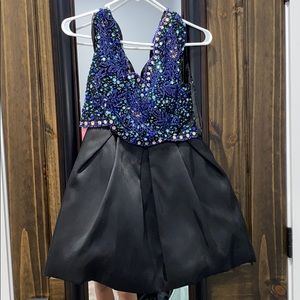 Formal dress Bottom is a size 6 and top is size 6